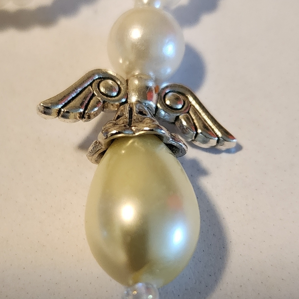 Elegant Silver and Cream Angel Wing Pendant Necklace